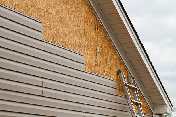 Professional Storm Damage Siding Repair technician working in Mechanicsburg, PA